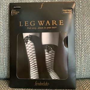 SENSUOUS FREDERICKS OF HOLLYWOOD Legware: black stockings w/crisscross & bow.